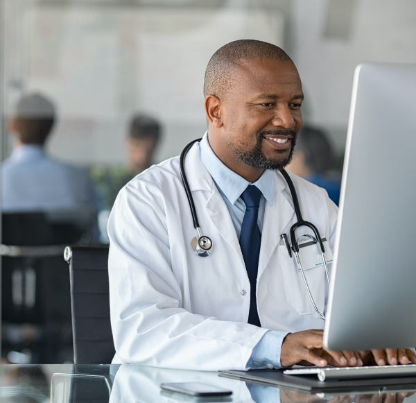 african-mature-doctor-working-on-computer-M68DJYR